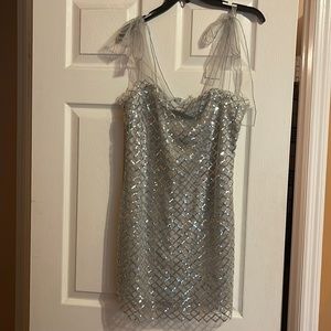 Silver sparkly dress with ribbon-tied shoulders. NWOT. Size Large (8-10)